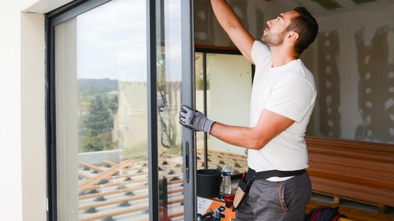 A sliding door being installed by one of our team