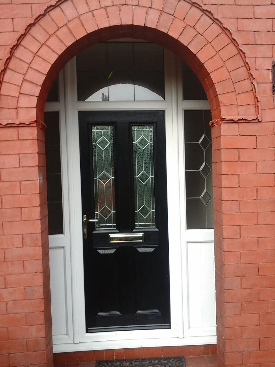 A new black door installed by our team for a residential customer