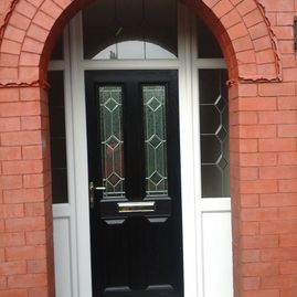 A new black door installed by our team for a residential customer