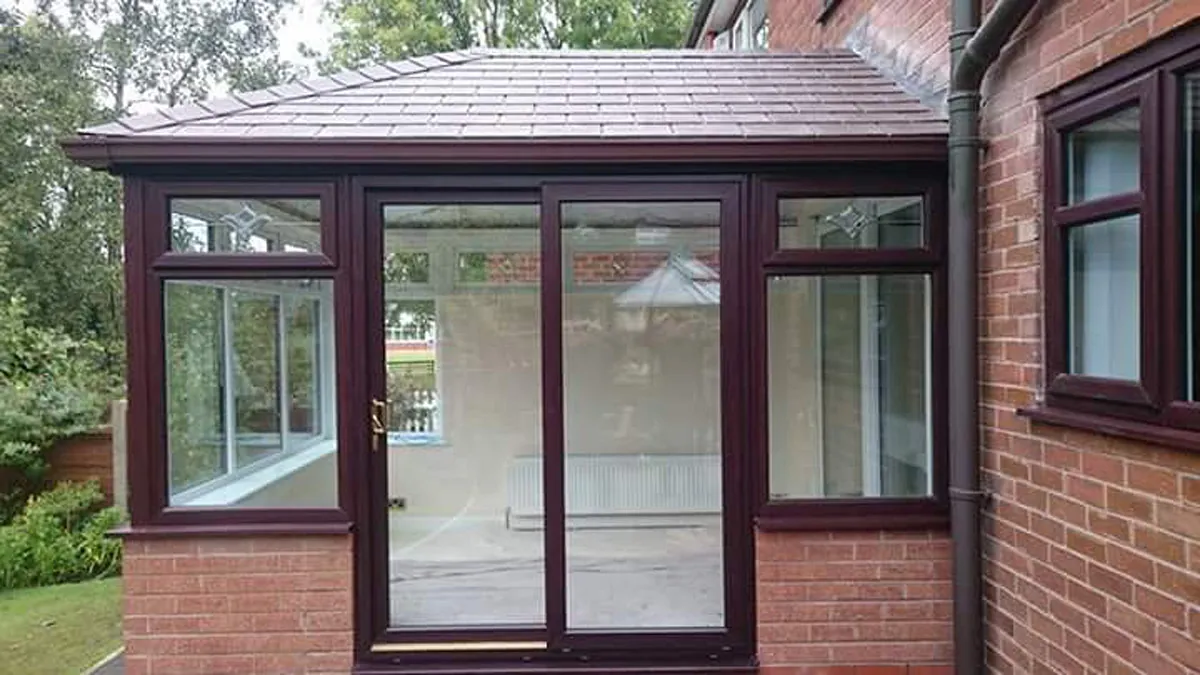 A new rosewood conservatory with sliding doors