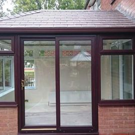 A new rosewood conservatory with sliding doors