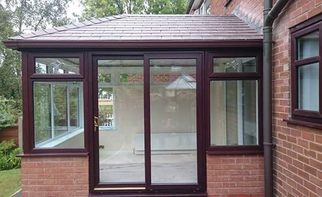 A new rosewood conservatory with sliding doors